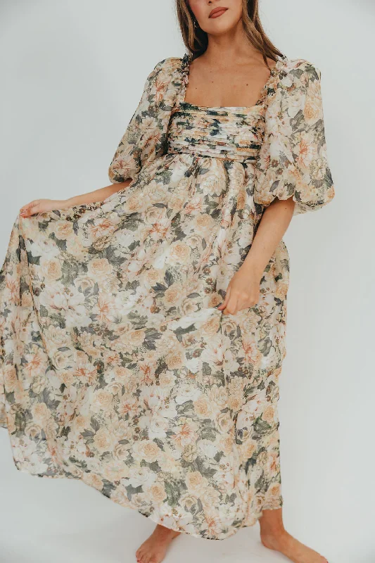 Midi dresses with pom - pom trims for a playful and festive look Melody Maxi Dress with Pleats and Bow Detail in Champagne Floral - Bump Friendly & Inclusive Sizing (S-3XL) Midi dresses with pom - pom trims for a playful and festive look Melody Maxi Dress with Pleats and Bow Detail in Champagne Floral - Bump Friendly & Inclusive Sizing (S-3XL)