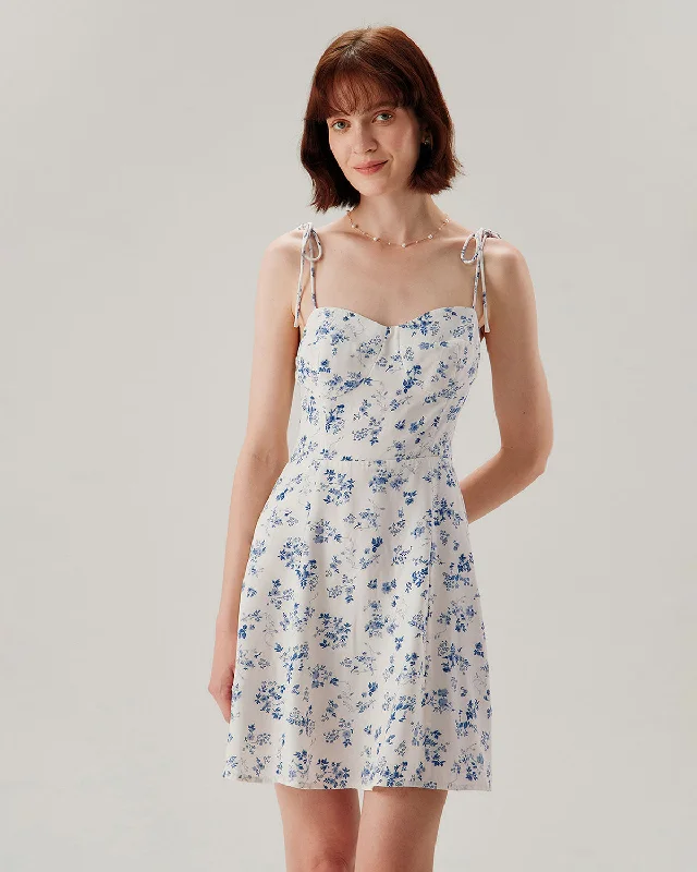 Mini dresses with pocket details for added functionality White Floral Shirred Tie Strap Mini Dress Mini dresses with pocket details for added functionality White Floral Shirred Tie Strap Mini Dress