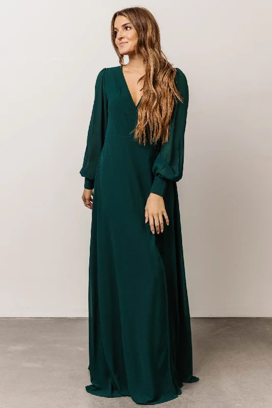 Maxi dresses with pom - pom trims for a playful and festive lookKelsey Wrap Dress | Emerald Maxi dresses with pom - pom trims for a playful and festive lookKelsey Wrap Dress | Emerald