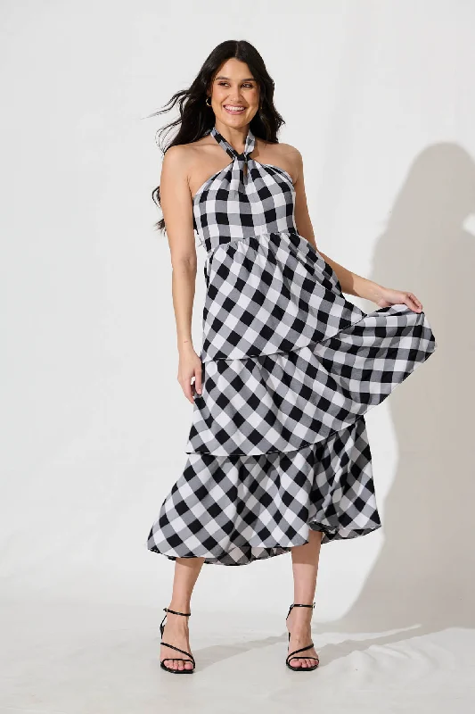 Midi dresses with pleated skirts for a timeless and elegant appealDolson Halter Neck Midi Dress in Black and White Gingham Midi dresses with pleated skirts for a timeless and elegant appealDolson Halter Neck Midi Dress in Black and White Gingham