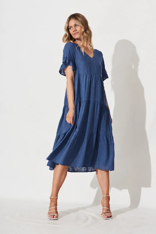 Midi dresses with pom - pom trims for a playful and festive lookKristen Midi Smock Dress In Blue Linen Blend Midi dresses with pom - pom trims for a playful and festive lookKristen Midi Smock Dress In Blue Linen Blend