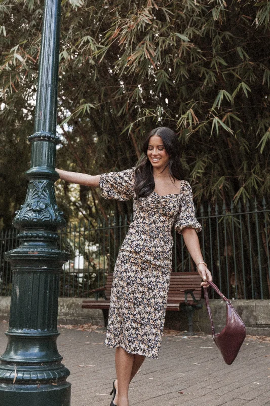 Midi dresses with puff sleeves for a vintage - inspired lookOona Midi Dress - Black Ditsy Floral Midi dresses with puff sleeves for a vintage - inspired lookOona Midi Dress - Black Ditsy Floral