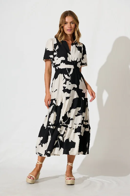 Midi dresses with pleated bodices for a classic and tailored lookQueeva Midi Dress in Black with Cream Floral Midi dresses with pleated bodices for a classic and tailored lookQueeva Midi Dress in Black with Cream Floral